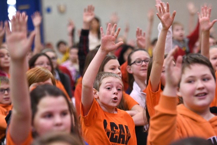 Oak Hill students hands up