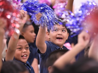 Paul Cuffee students wave pompoms