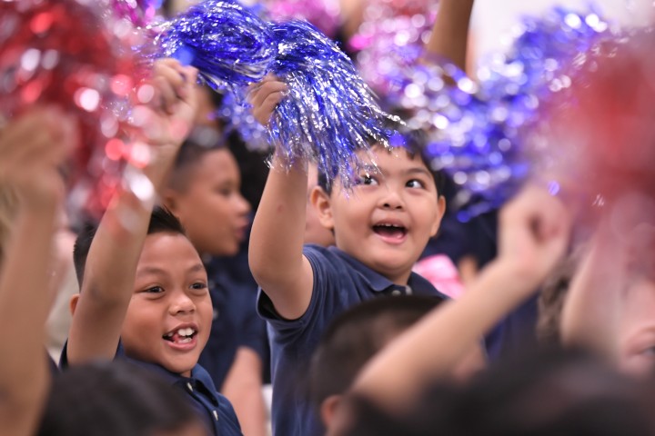 Paul Cuffee students wave pompoms