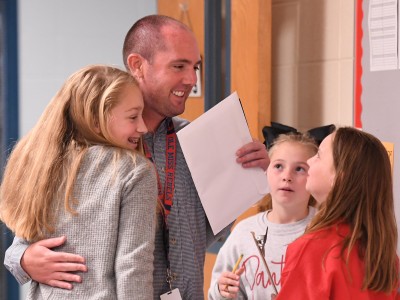 Petal Tyler Shows students hug