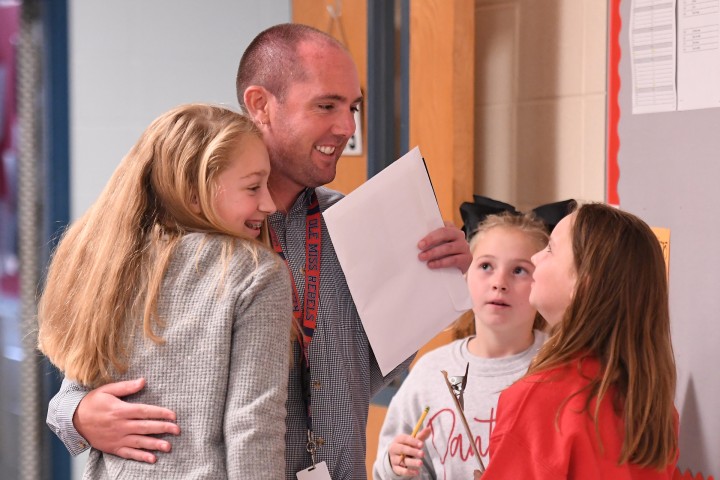 Petal Tyler Shows students hug