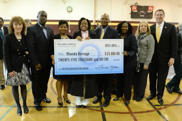 Rhonda Burrage check with local dignitaries