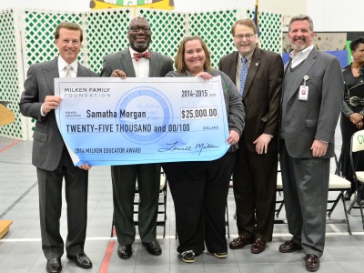 Samatha Morgan Lowell Milken and VIPs with check