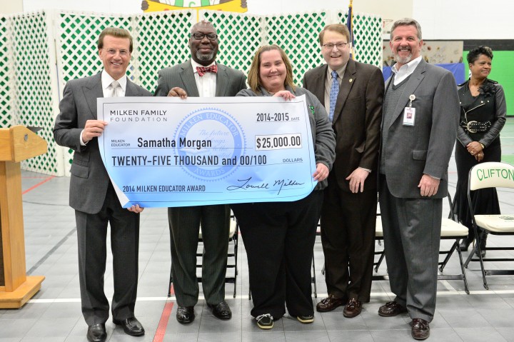 Samatha Morgan Lowell Milken and VIPs with check