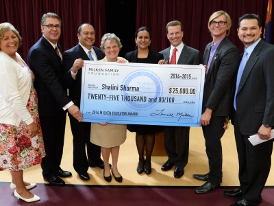Shalini Sharma Gary Stark Lowell Milken pose with check