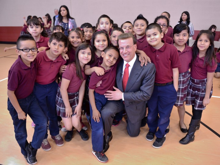 Shalini Sharma Lowell Milken poses with students