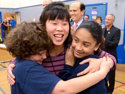 Teresa Chan Seidel gets hugs from students
