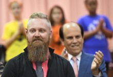 Thomas Dennison listens to applause