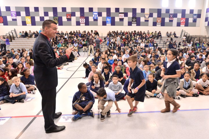 Timothy Thomas with students before assembly