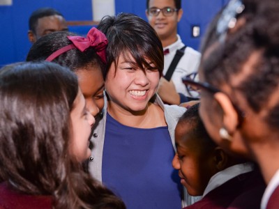 Tracy Espiritu gets hugs from students