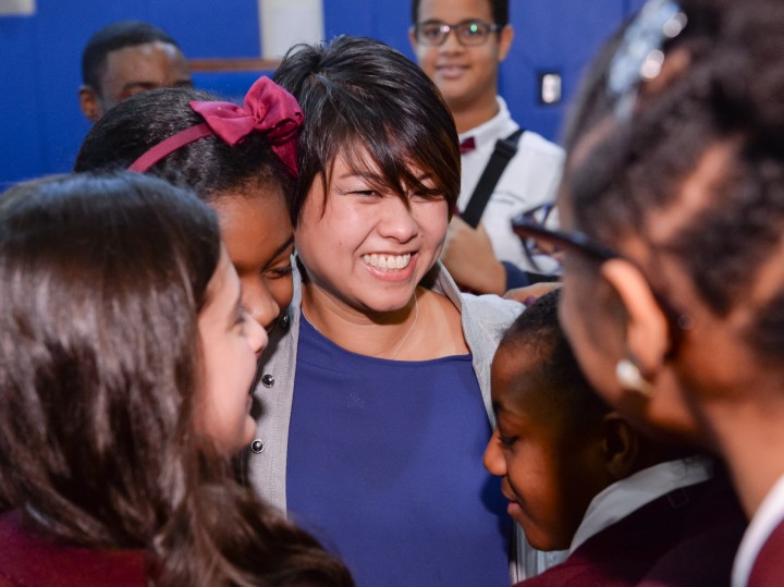 Tracy Espiritu gets hugs from students