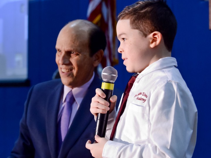 Tracy Espiritu student volunteer with Mike Milken