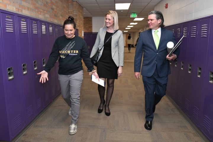 Wachter Erica Quale walks to classroom