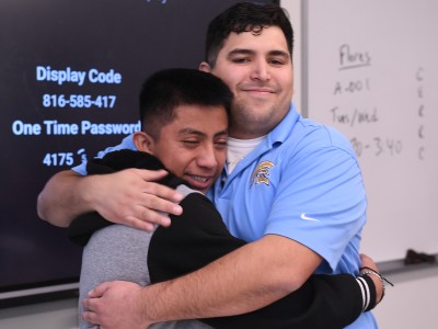 greeley caleb flores student hug