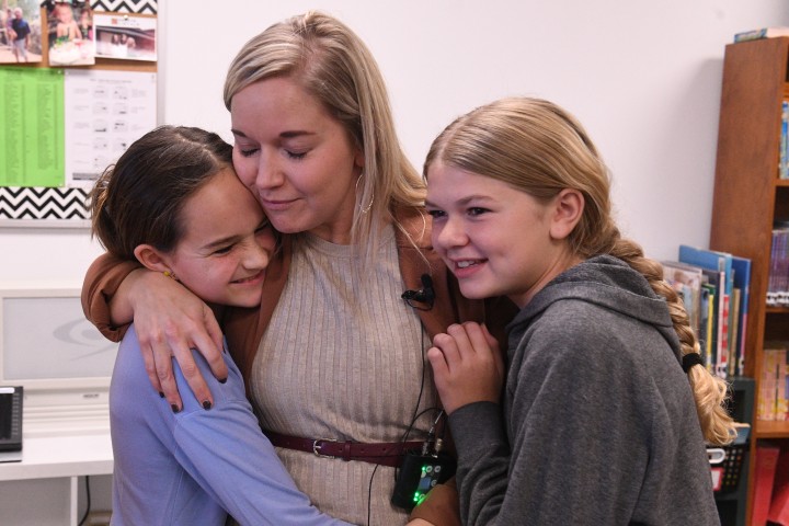 sms leslie mcintosh students hug