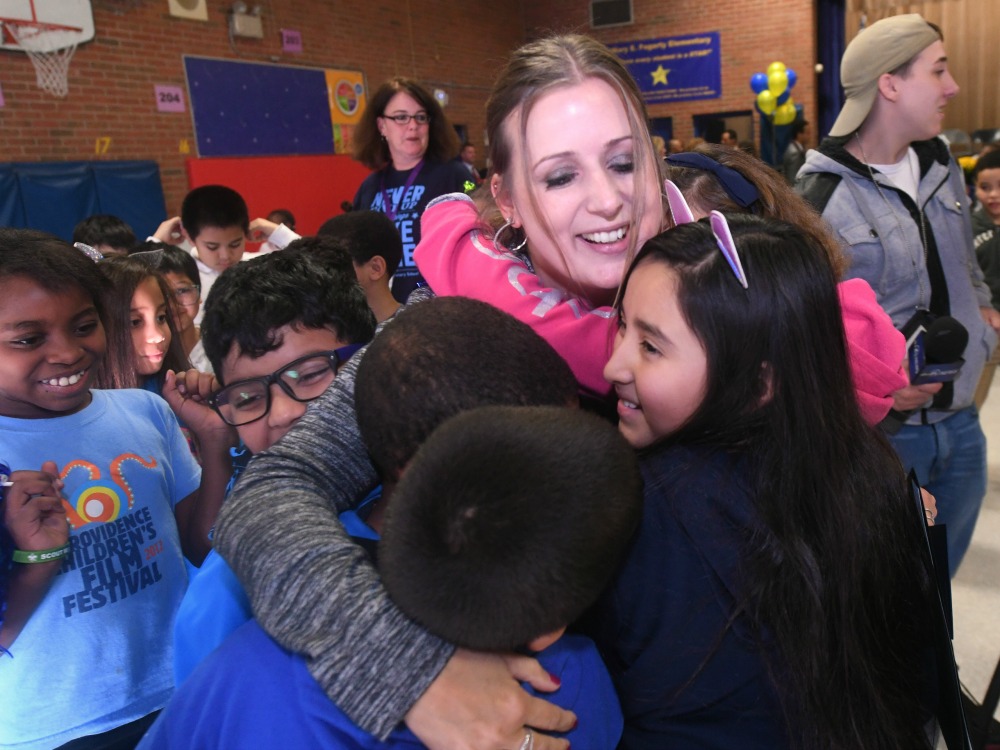 1000w 2018 Providence Michelle Johnson students hug