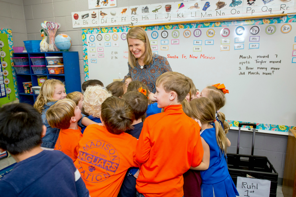 Allison Ruhl with excited students 1000w