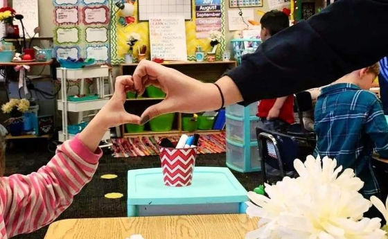 Hailey Couch heart hands 560x345