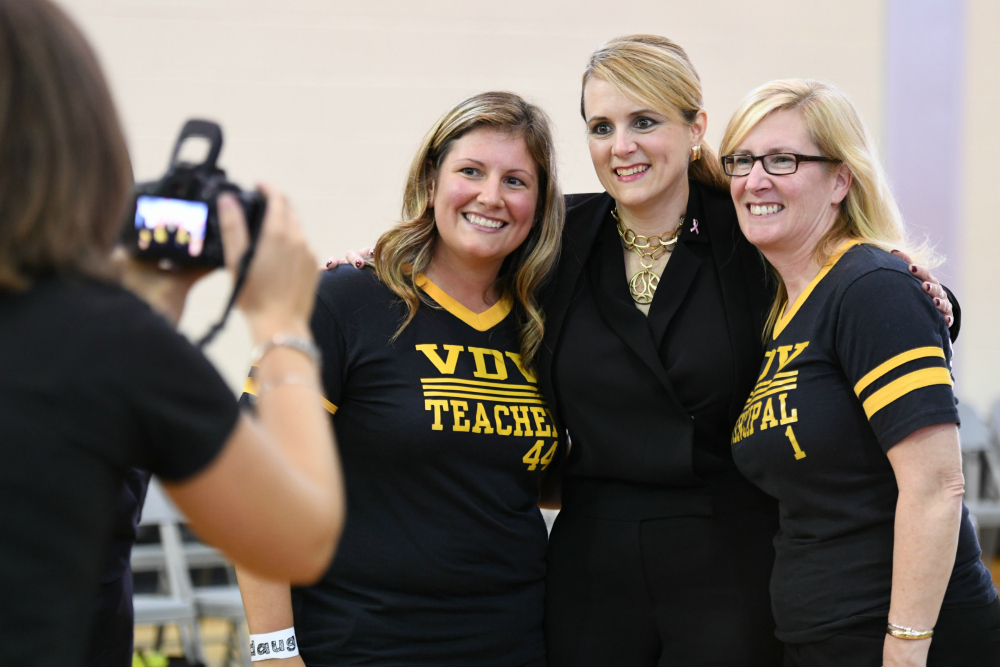 Lindsay Frevert poses with dignitaries 1000w