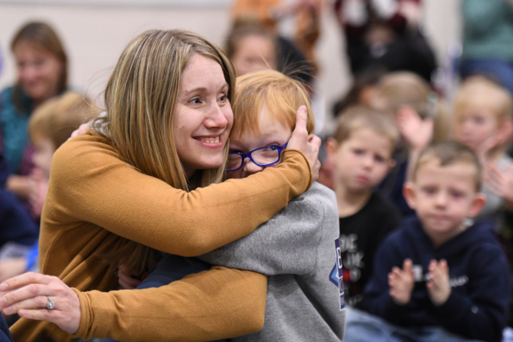 Meadowlark Jessica Kavitz student hug 1000w