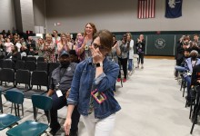 DFMS Lesley Snyder walks to front