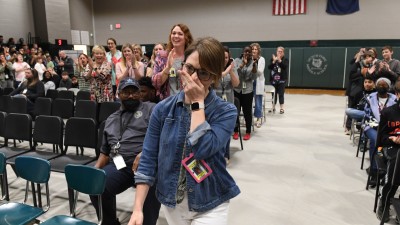 DFMS Lesley Snyder walks to front