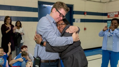 Eric Crouch hugs principal