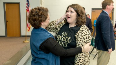 Kara Davis hug from principal